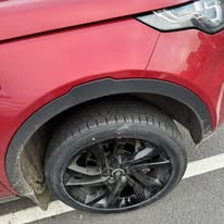 Flat tyre inspected before mobile help